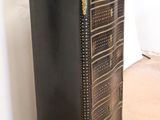 a black and gold chest of drawers in a room