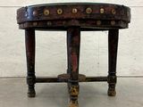 an image of a small table with a leather top and brass hardware on the legs