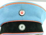 a blue hat with an orange stripe on it