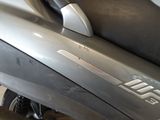 a close up of a motor scooter parked in a garage