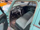 an old car that is sitting in a lot