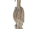 a bird that is sitting on a tree stump