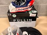 a helmet and a t - shirt sitting on a table