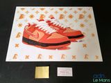an image of a pair of orange sneakers on a table