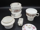 an image of a group of porcelain dishes and cups on a table