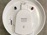 a picture of a toilet with the lid down and the tank open