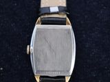 an image of a watch sitting on top of a black surface