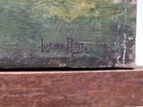 a close up of a painting on a wooden table