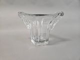 clear glass vase on a white surface with a white background