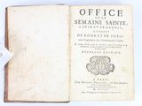 an old book opened to show the title of a book