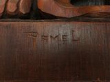 a close up of a wooden carving of a bird