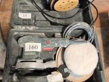 une image représentant une boîte à outils contenant une ponceuse, une ponceuse et d'autres objets