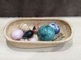 a wicker basket filled with shells on a table