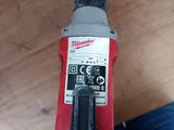 a close up of a drill on a wooden floor