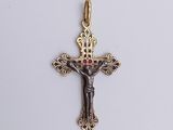 an image of a gold cross with a red stone in the center