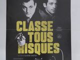 une affiche de film représentant deux hommes armés devant une voiture