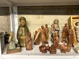 many figurines that are on a shelf in the room