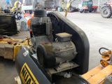 a machine that is sitting in the middle of a warehouse