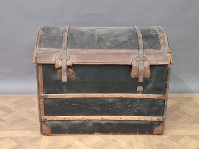 an old trunk sitting on the floor on the floor
