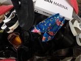 many pairs of shoes that are in a box