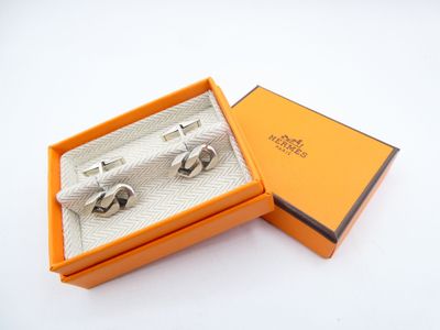 an image of a pair of cufflinks in an orange box