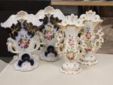 three vases that are sitting on a table