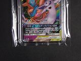 a close up of a pokemon card in a plastic case