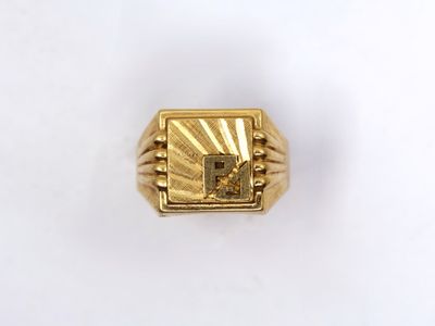 an image of a gold ring with a square stone in the center
