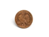 a close up of a coin on a white surface