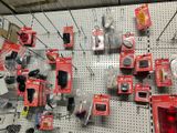 many electronic devices on the wall of a store