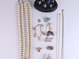 an assortment of jewelry including a purse, necklaces, and earrings