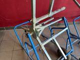 a blue cart that is sitting on a tiled floor