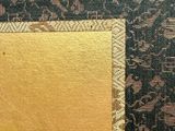 a picture of a black and gold wallpaper with a gold frame