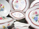 many different types of plates and bowls on the table