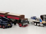 a lot of toy trucks that are lined up together