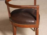 an image of a chair with a brown leather seat and wooden frame