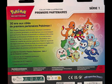 a box of pokemon cards on a black background