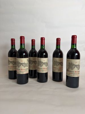 six bottles of wine are lined up on a table
