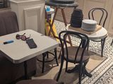 a table and chairs in the corner of a room