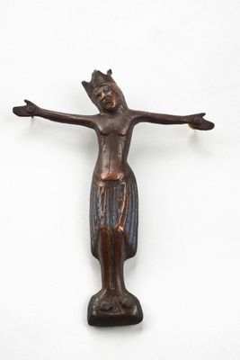 an image of a wooden statue of a person on a cross