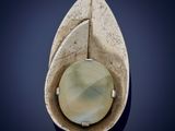 an image of a close up of a ring with a stone in it