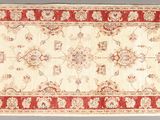 a red and white rug with a pattern on it