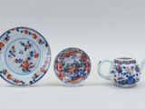 three pieces of chinese porcelain, including a teapot and saucer