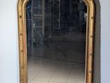 a mirror that is sitting on the floor in a room