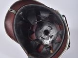 a close up of a helmet on a white surface