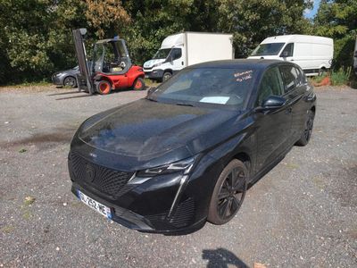 a black car that is parked in a parking lot