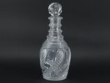 clear glass decanter with a bird on the top of it