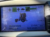 a picture of a car ' s dashboard with a picture of a tractor on it