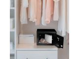 an image of a closet with clothes hanging on a rack