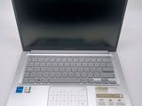 an open laptop computer sitting on top of a white table